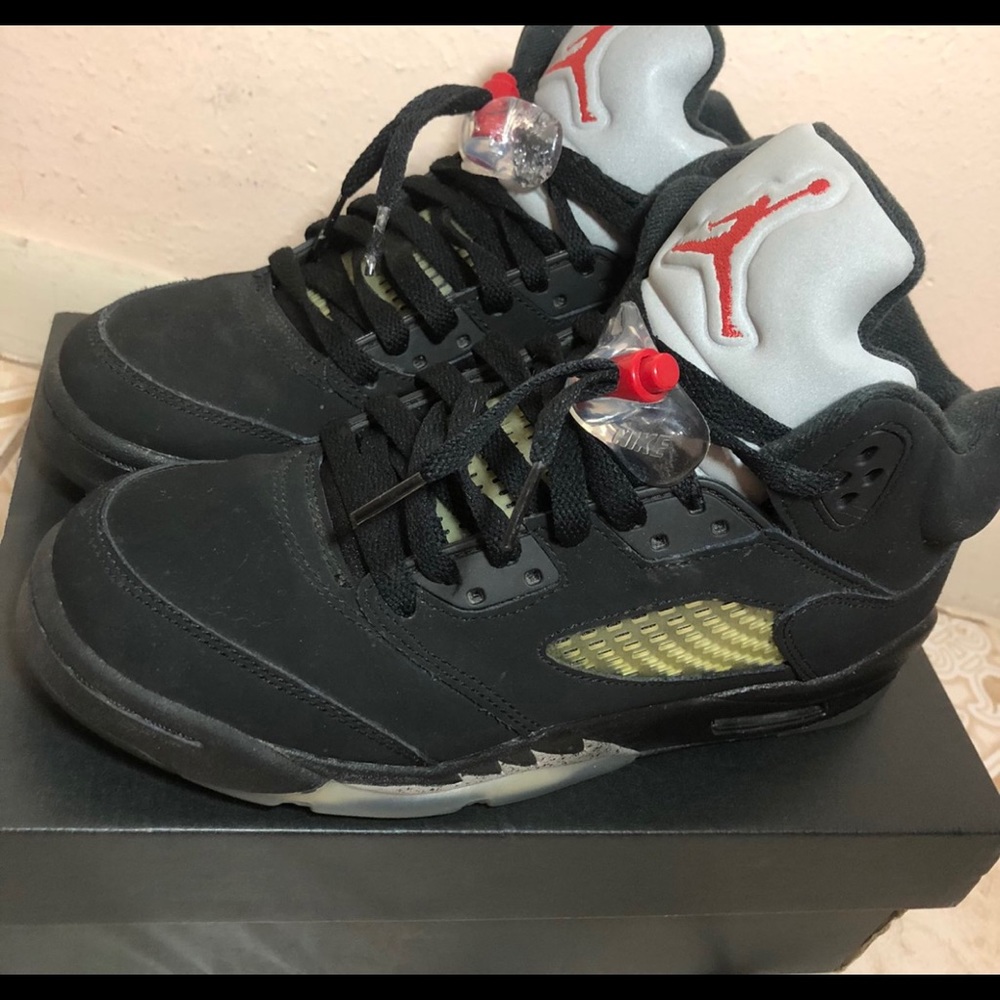 Black metallic Jordan 4s